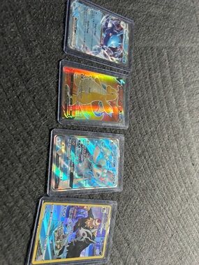 Primarina holo GX, Dragonite V holo, kingdra ex holo, Mightyena holo